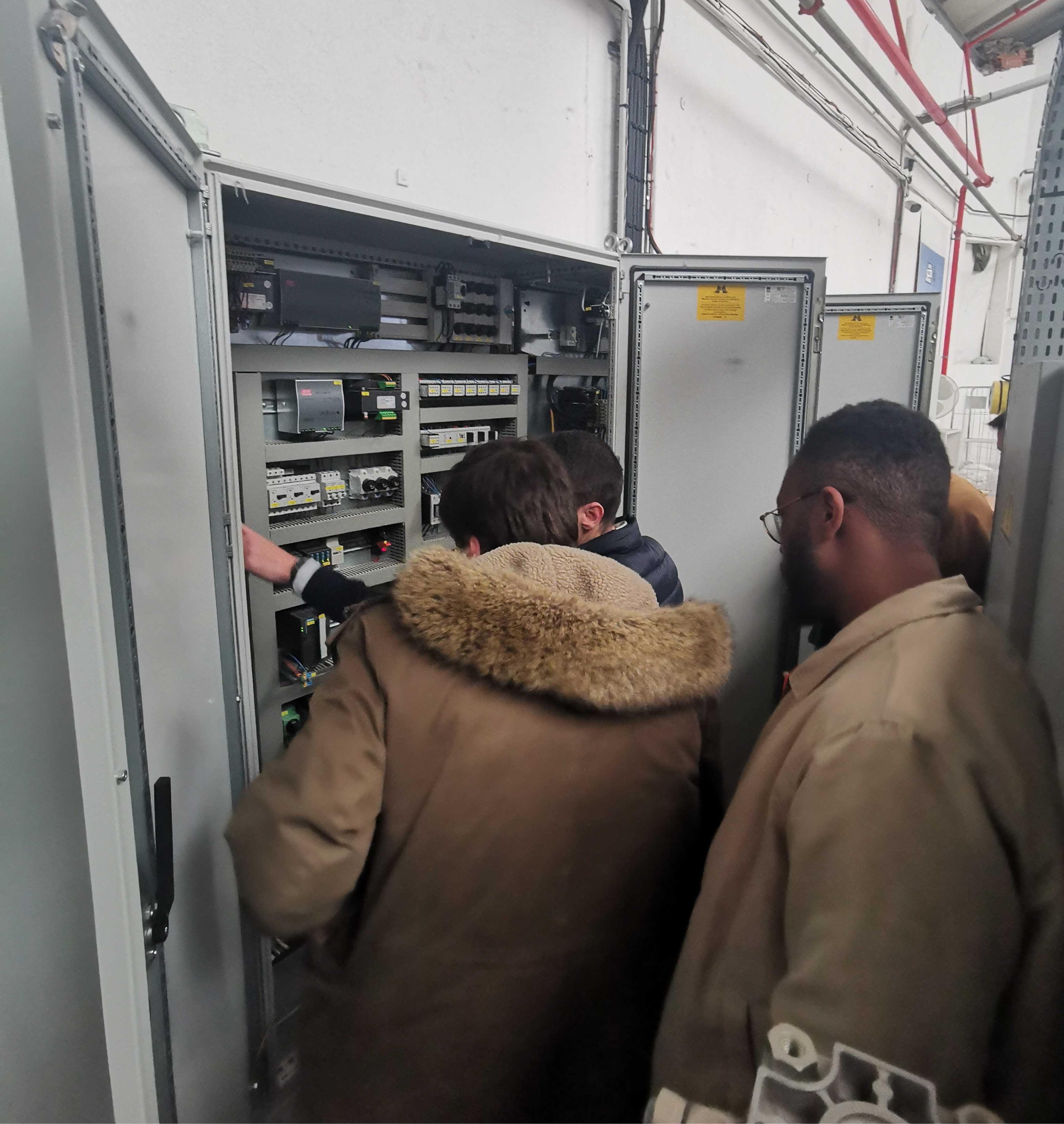 A programmable logic controller wired into a legacy factory machine.